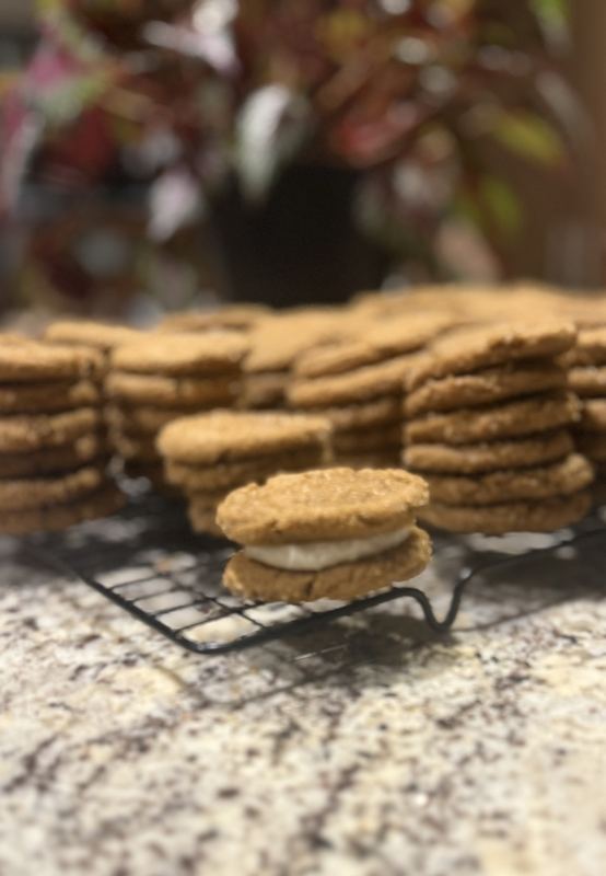 Stacks of spiced sandwich cookies with cream filling